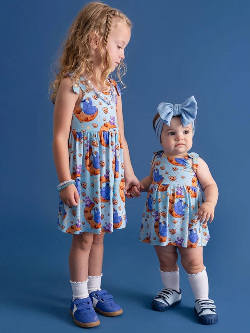 Posh Peanut Care Bears Light Blue Bow Babydoll Dress with Orange & Purple Prints